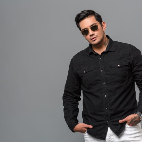 Serious concentrated young man standing isolated Shirt A